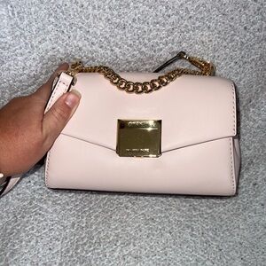 Mini light pink Michael Kors bag, new with tags.
